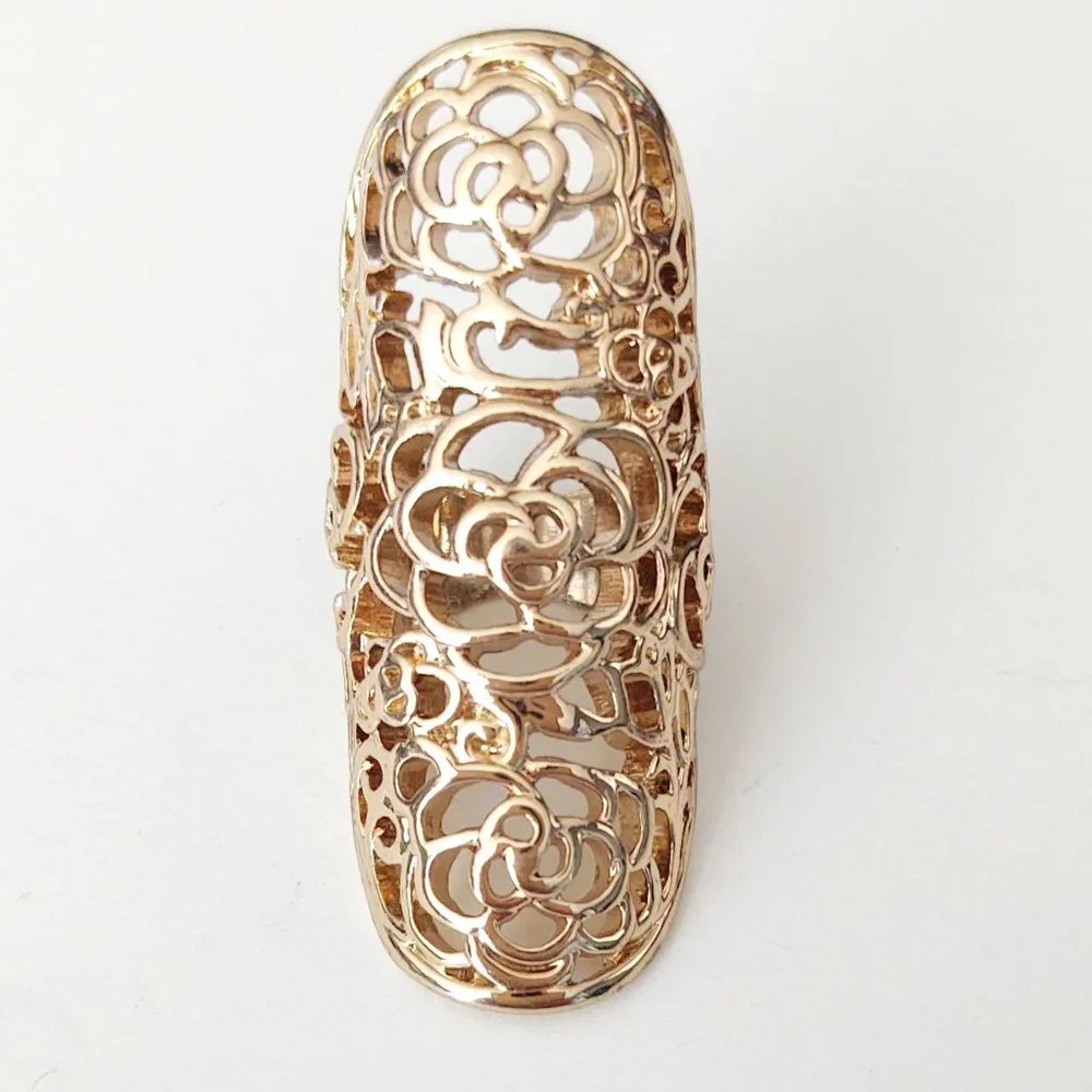 Long, open scroll design gold ring